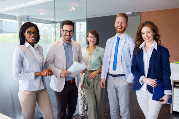 istock Group portrait of successful office team at work 1319010909