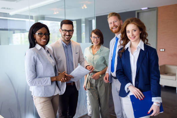 istock Group portrait of successful office team at work 1319010950