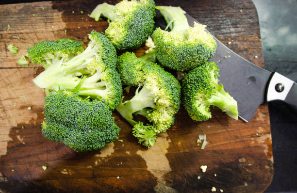 istock Broccoli cut on a wooden cutting board 1319011035