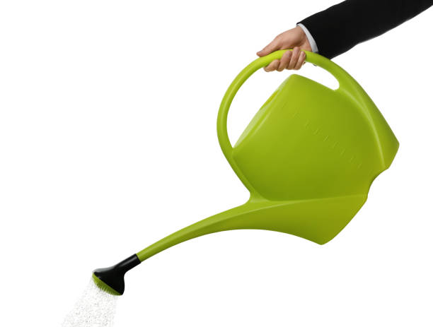 istock Businessman pouring water from can on white background, closeup 1319013061