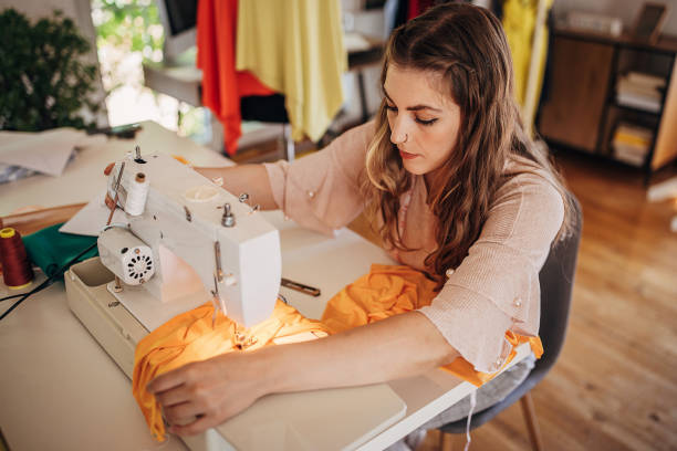 istock Female fashion designer sewing 1319013263