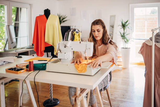 istock Female fashion designer sewing 1319013469