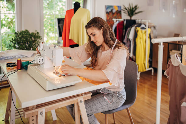 istock Female fashion designer sewing 1319013489