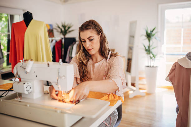 istock Female fashion designer sewing 1319013513
