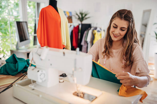istock Fashion designer working in workshop 1319014632