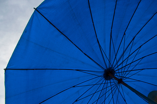 The blue monochromatic picture of the umbrella.