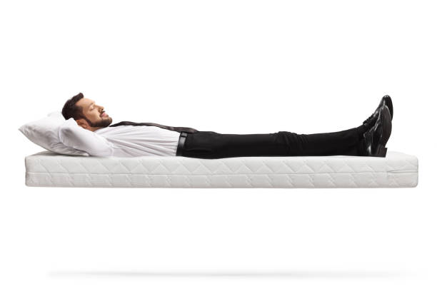 istock Man lying on a floating mattress with clothes and shoes 1319015069