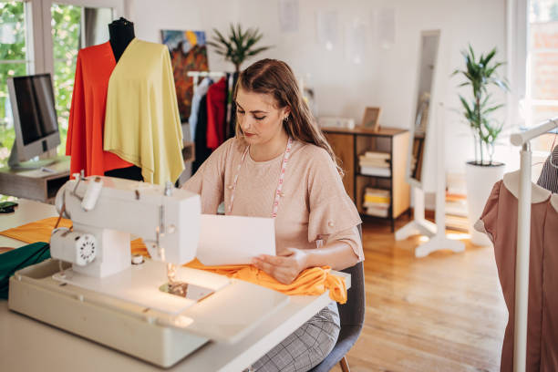 istock Fashion designer working in workshop 1319015395