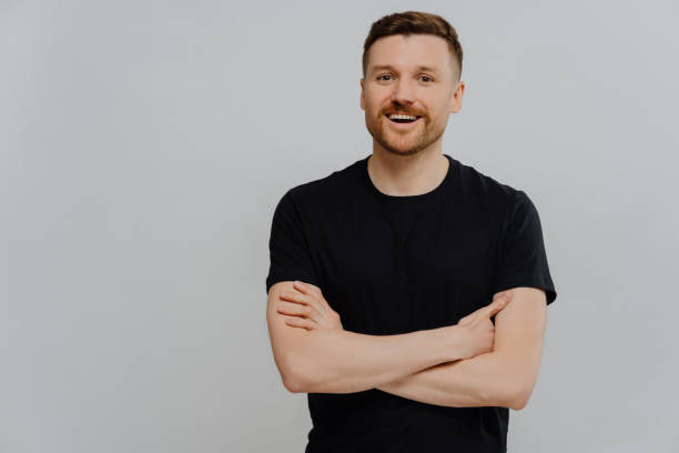 istock Positive young man posing in studio with happy facial expression 1319016067