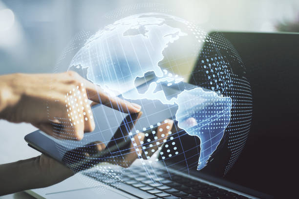 istock Digital America map and finger presses on a digital tablet on background, global technology concept. Multiexposure 1319016099