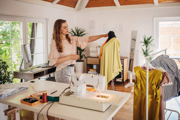 istock Female fashion designer in her studio 1319016191