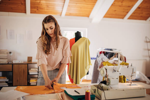 istock Female fashion designer in her workshop 1319016222