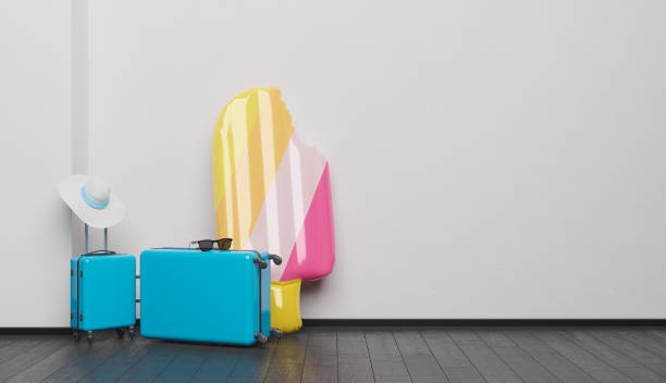 istock suitcases and inflatable ice cream on white wall 1319016546