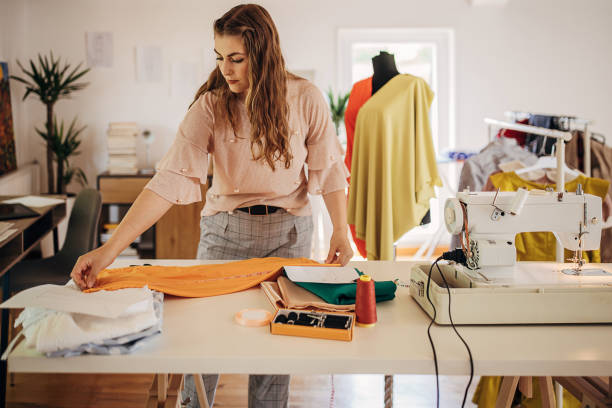 istock Female fashion designer in her workshop 1319019266