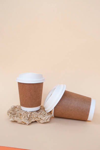 istock Bidegradable paper brown coffee cups with biodegradable white lids. 1319019426