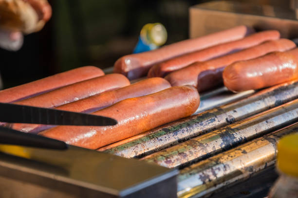 istock Sausages are fried on a rotary cooking machine 1319020684