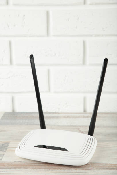 istock Wireless Wi-Fi router on a white background. Vertical photo 1319020713