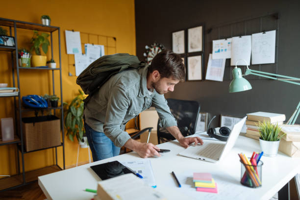 istock Serious millennial businessman coming to work to modern office 1319021743