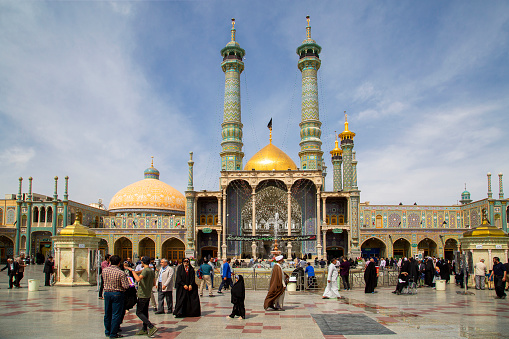 Qom, Iran - April 11, 2018: People visit the Holy Shrine of Lady Fatima Masumeh, in Qom, Iran. Lady Fatima Masumeh was the sister of Imam Reza, one of the twelve imams in Islam