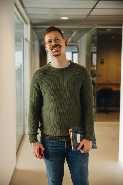 istock Successful businessman standing in office 1319022829