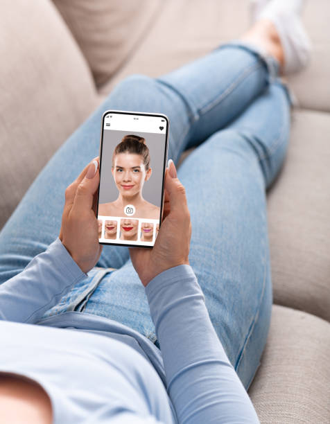 istock Augmented Reality Beauty App. Woman Trying Different Lipstick Color Online 1319023549
