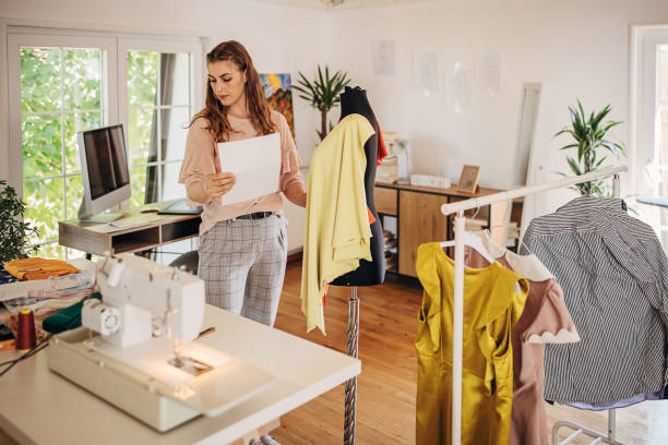 istock Female fashion designer in her studio 1319024401