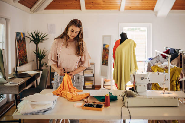 istock Female fashion designer in her workshop 1319024483