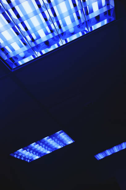 istock Abstract background with blue fluorescent lights. Neon glow from the ceiling lights 1319024650
