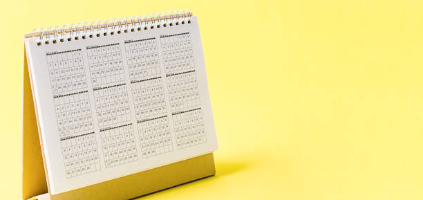 istock Desktop calendar 2021 on yellow background with empty space 1319026457