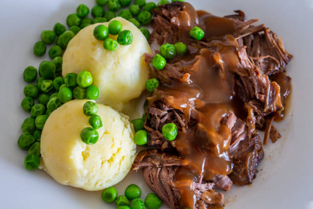 istock Butterflied beef with mashed potatoe and peas 1319027232
