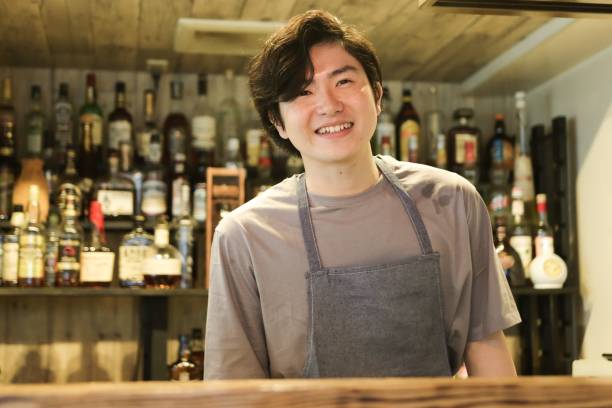 istock Young Asian man working at cafe and bar 1319027609