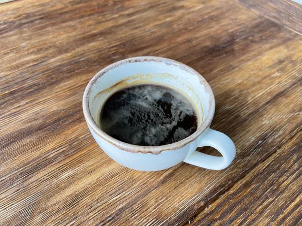istock cup of coffee on wooden table 1319027765