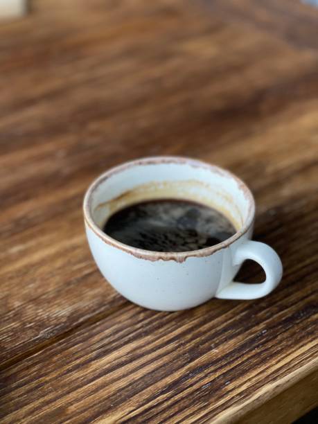 istock cup of coffee on wooden table 1319027779