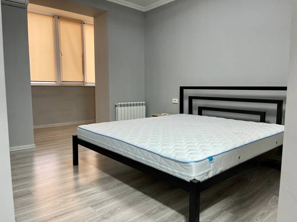 istock interior of a bedroom with bed and matress 1319027973