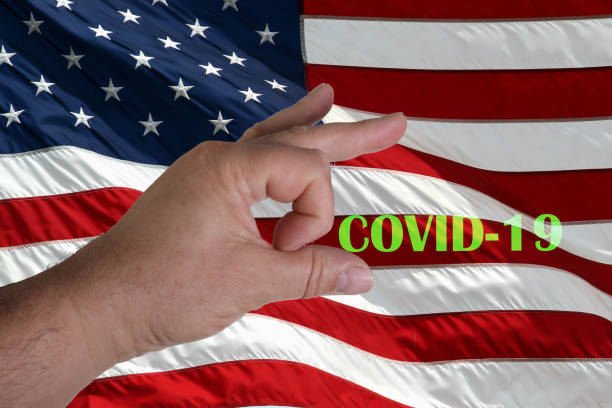 istock American flag with hand s OK symbol and covid-19 text 1319029128