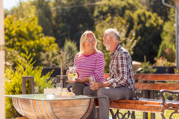 istock Elderly couple having an outdoor brunch 1319030790