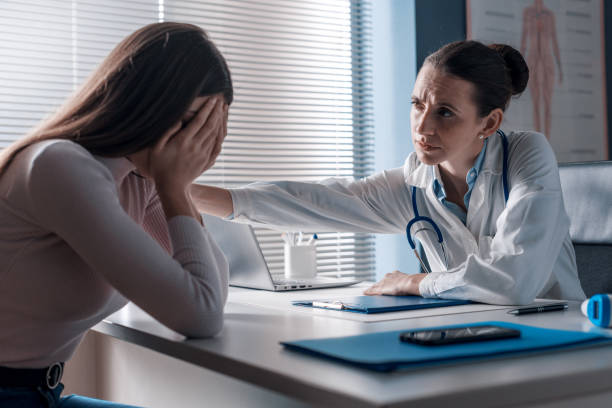 istock Doctor assisting a crying patient in the office 1319032126