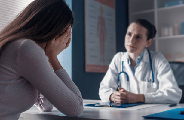 istock Doctor assisting a crying patient in the office 1319032256