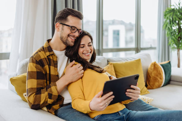 istock Happy couple, at home, relaxing. 1319032483