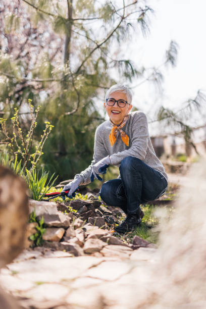 istock Portrait of a senior enjoying while gardening. 1319033993