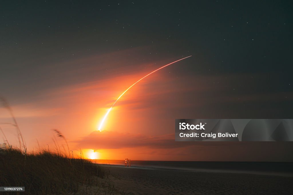 SpaceX Falcon 9 Rocket Launch from Melbourne Beach Long exposure night shot of a rocket launch from the beach at night Rocketship Stock Photo