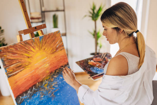 istock Woman artist painting 1319037314