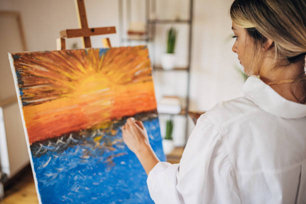 istock Female artist painting 1319037333