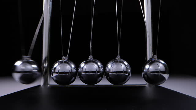 Balance newton's cradle ball in slow motion