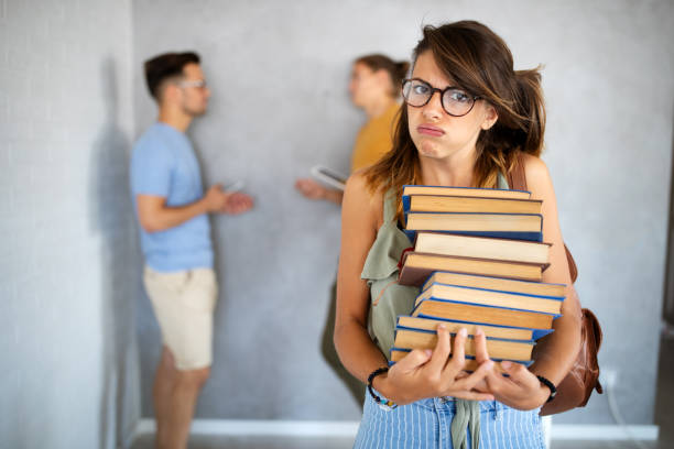 istock Eager student overwhelmed by studying and reading books 1319040217