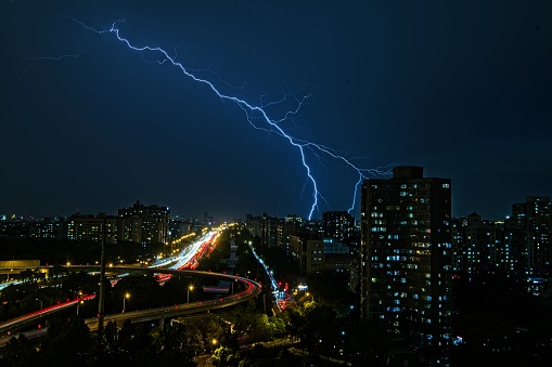 Cityscape view over city center of Beijing when thunderstorm strike.