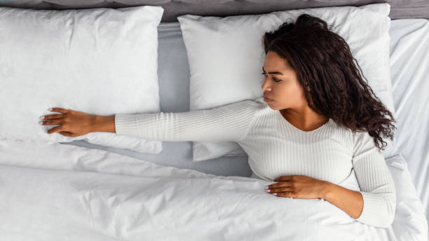 istock Black woman suffering from loneliness in bed 1319040913