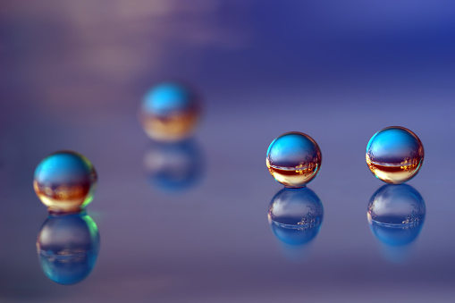 An abstract photo of a water ball that looks like real water drops. Illuminated give a 3D effect