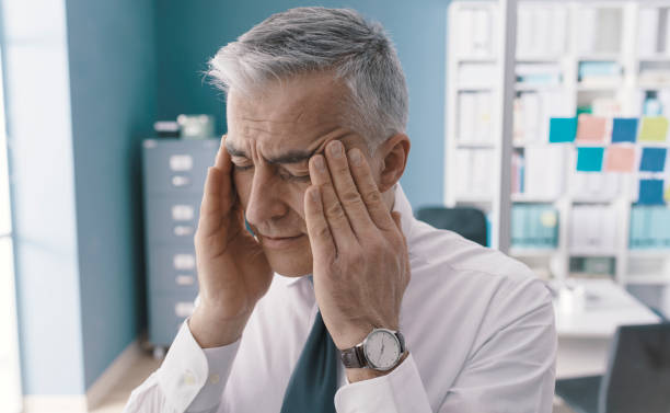 istock Corporate businessman having a bad headache 1319045038