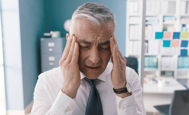 istock Corporate businessman having a bad headache 1319045553